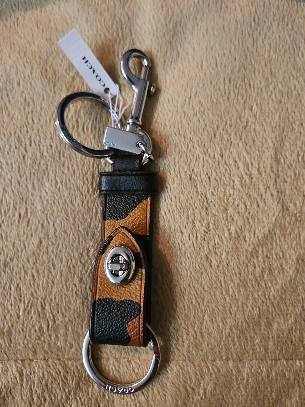 Coach trigger snap bag charm