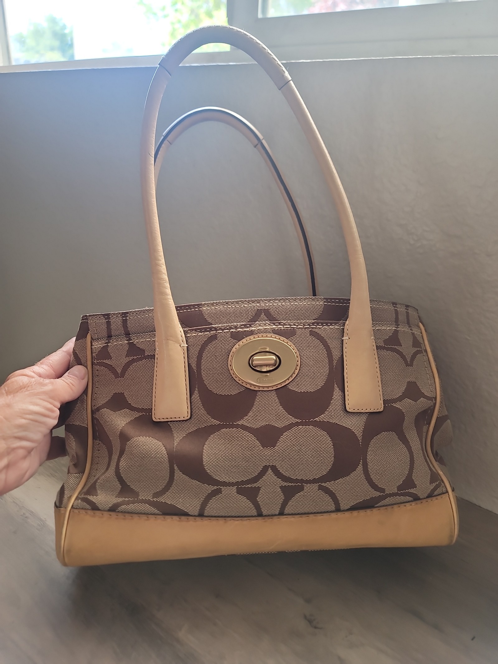 Coach bag. One of my favorites. Mid size hand bag. W leather trim