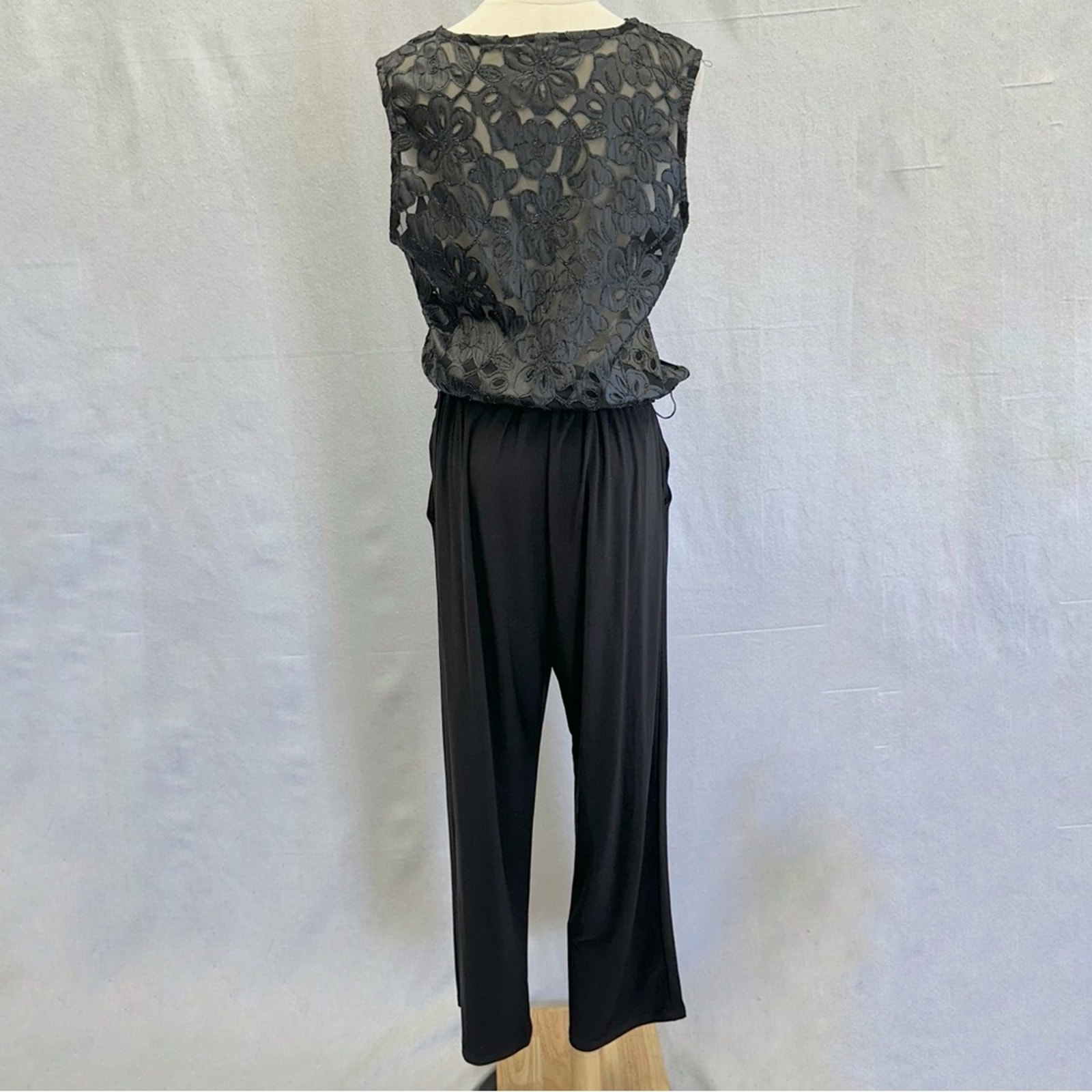 Cache black surplice front jumpsuit with lace appliqué semi sheer back size 14