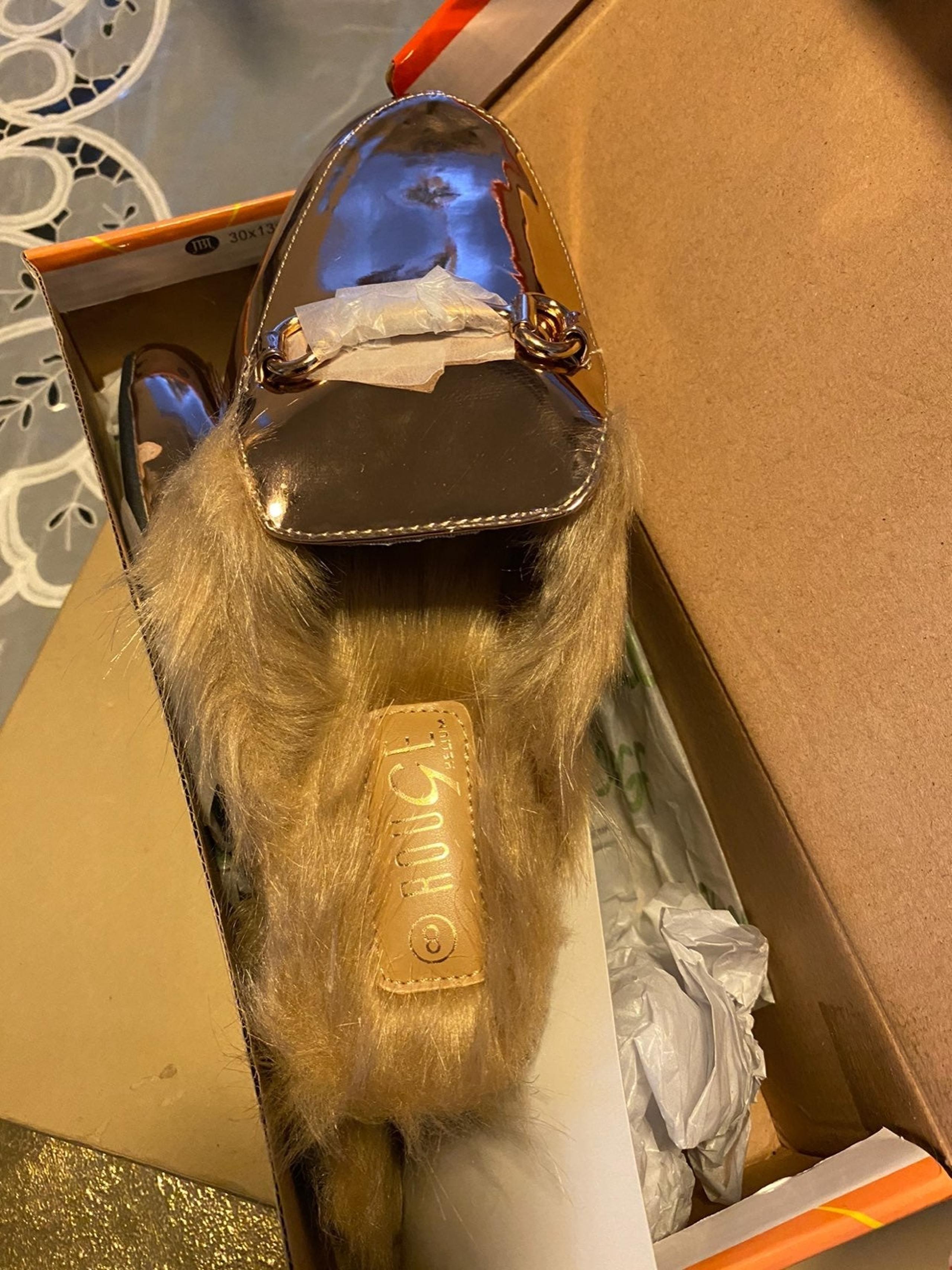 Faux fur mule.