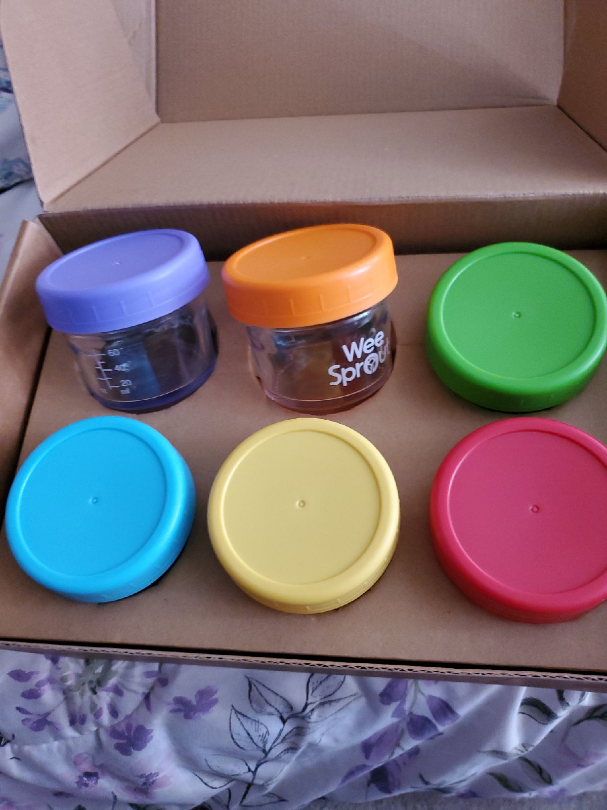Glass baby food storage jars.
