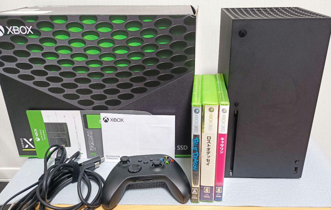Xbox Series X console with controller and 3 games.