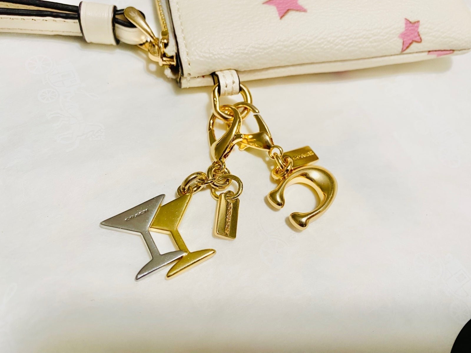 Coach key chain bag charm bundle of two gold and silver NEW