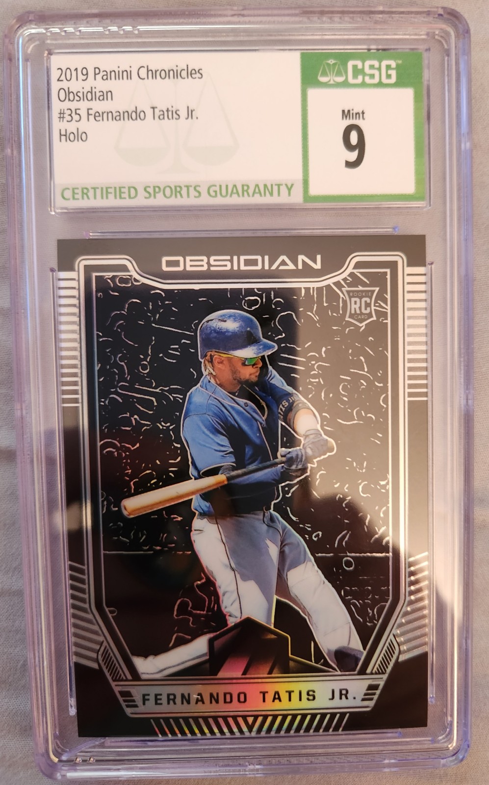 2019 panini chronicles obsidian fernando tatis jr holo. Graded by CSG mint 9.