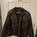 Brown leather motorcycle jacket.