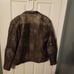 Brown leather motorcycle jacket.
