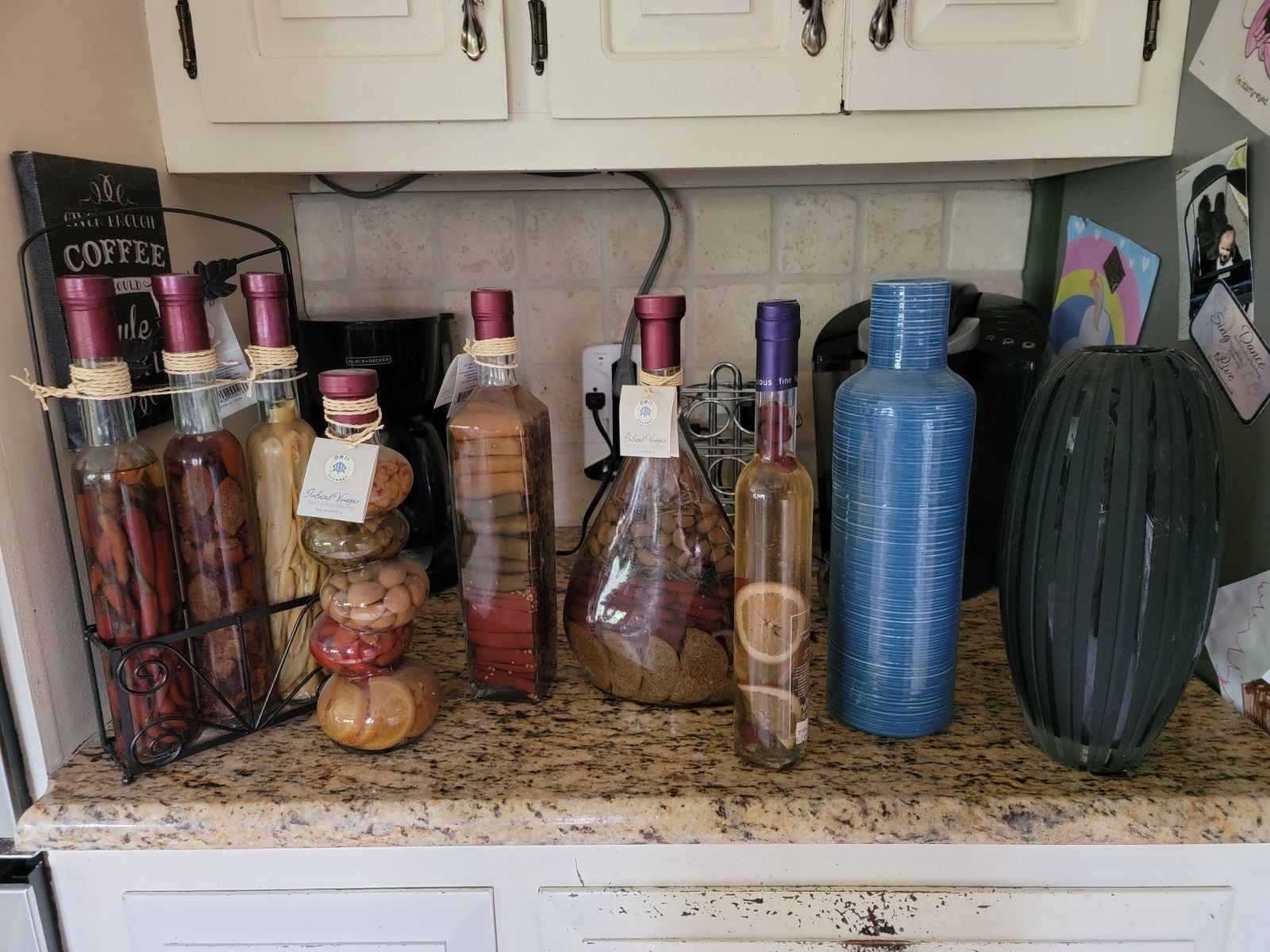 Decorative faces and bottles.