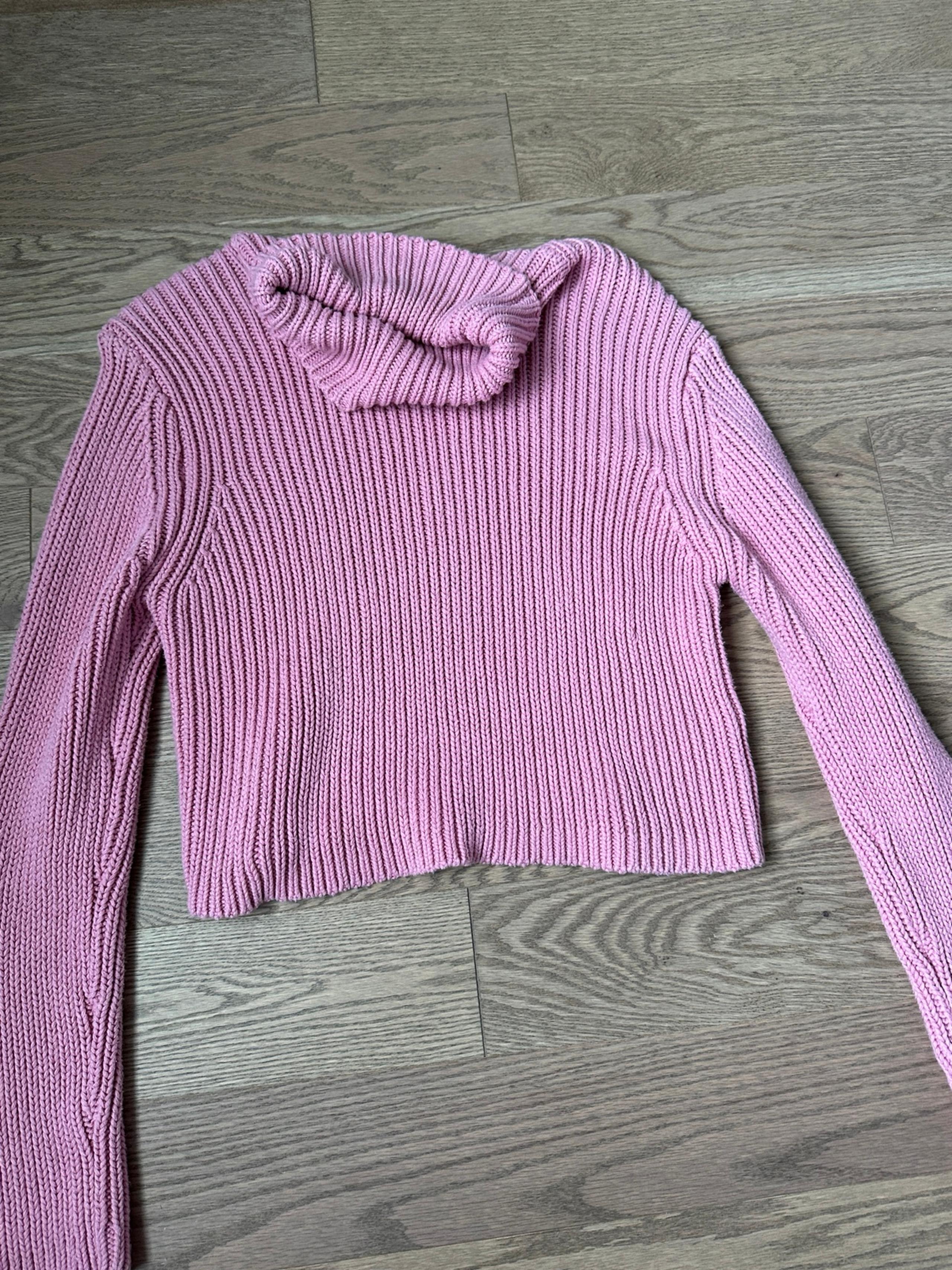 Pink turtleneck sweater
