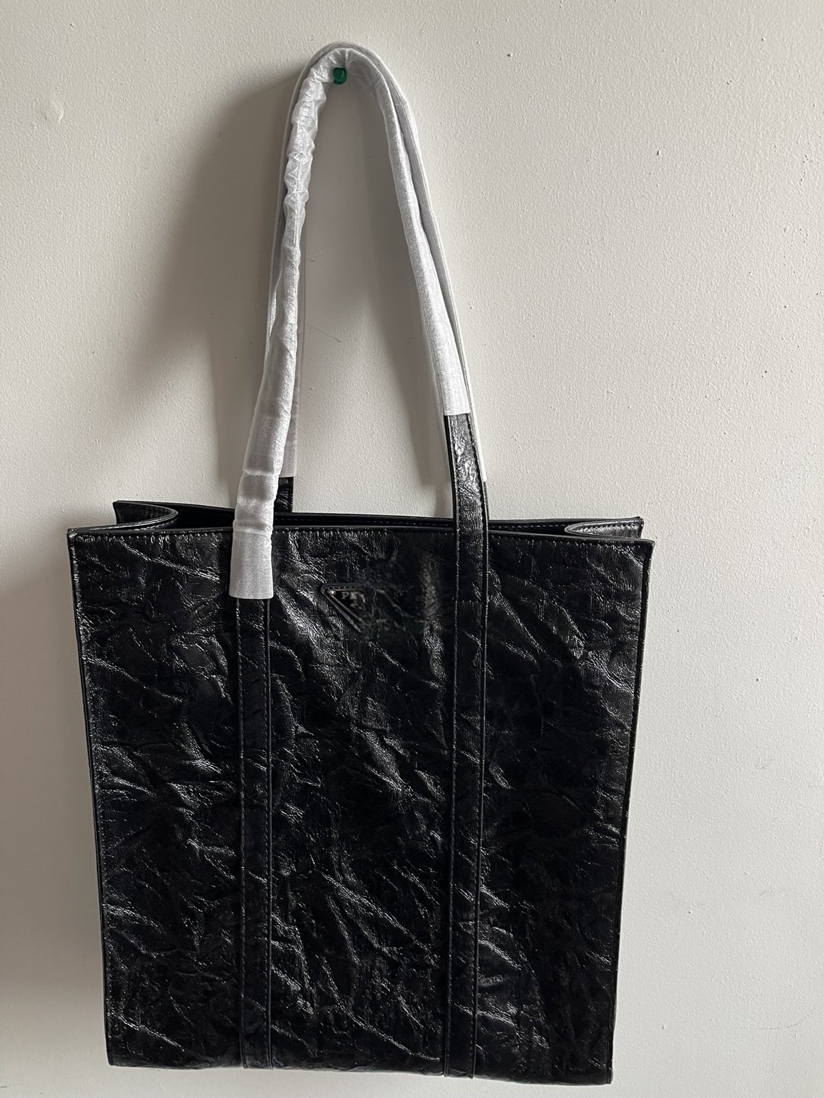 NIB: A black crinkled leather P inspo tote with leather interior.