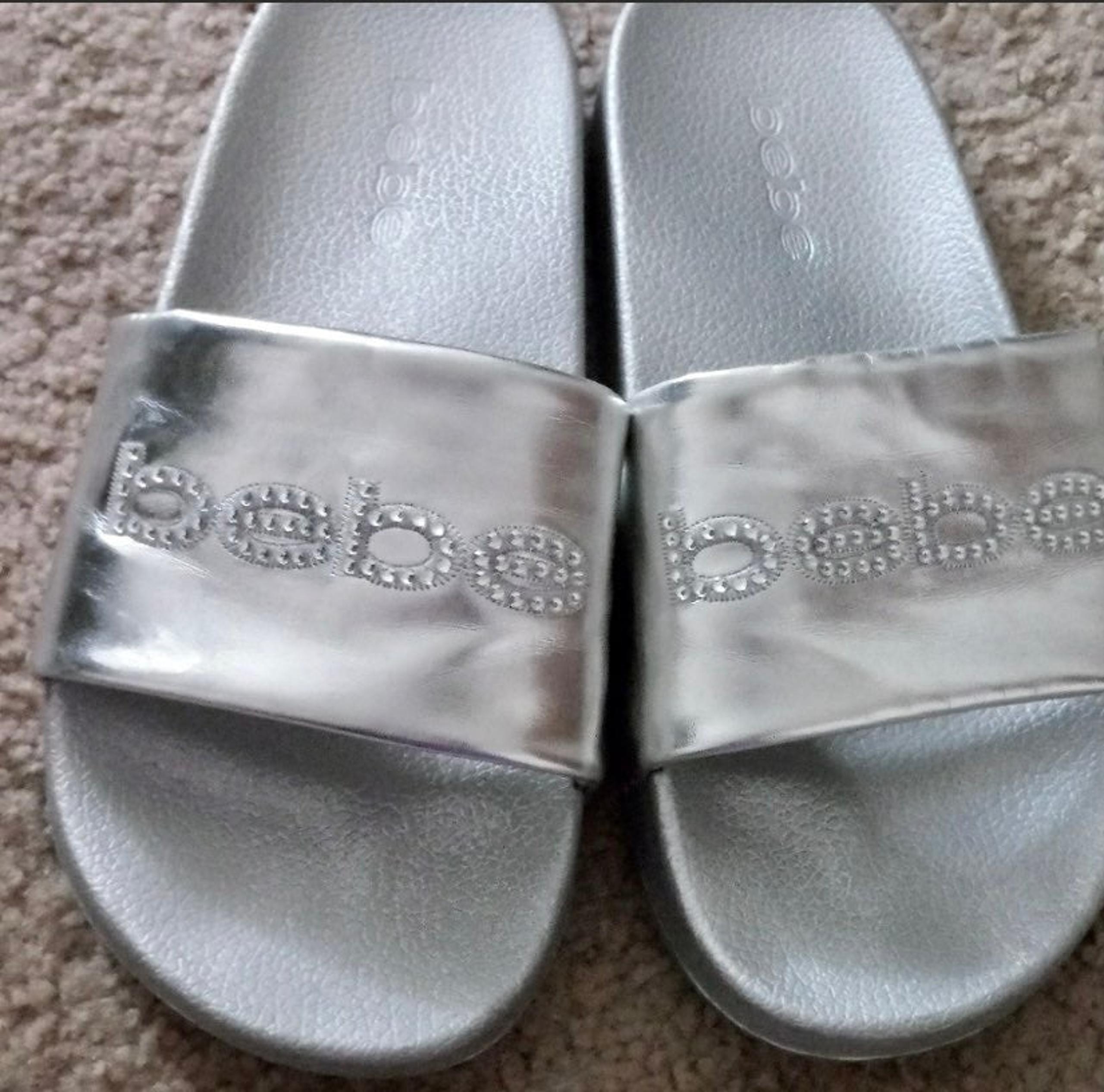 FELIZIA BEBE LOGO SLIDES....Sz: 7....Silver