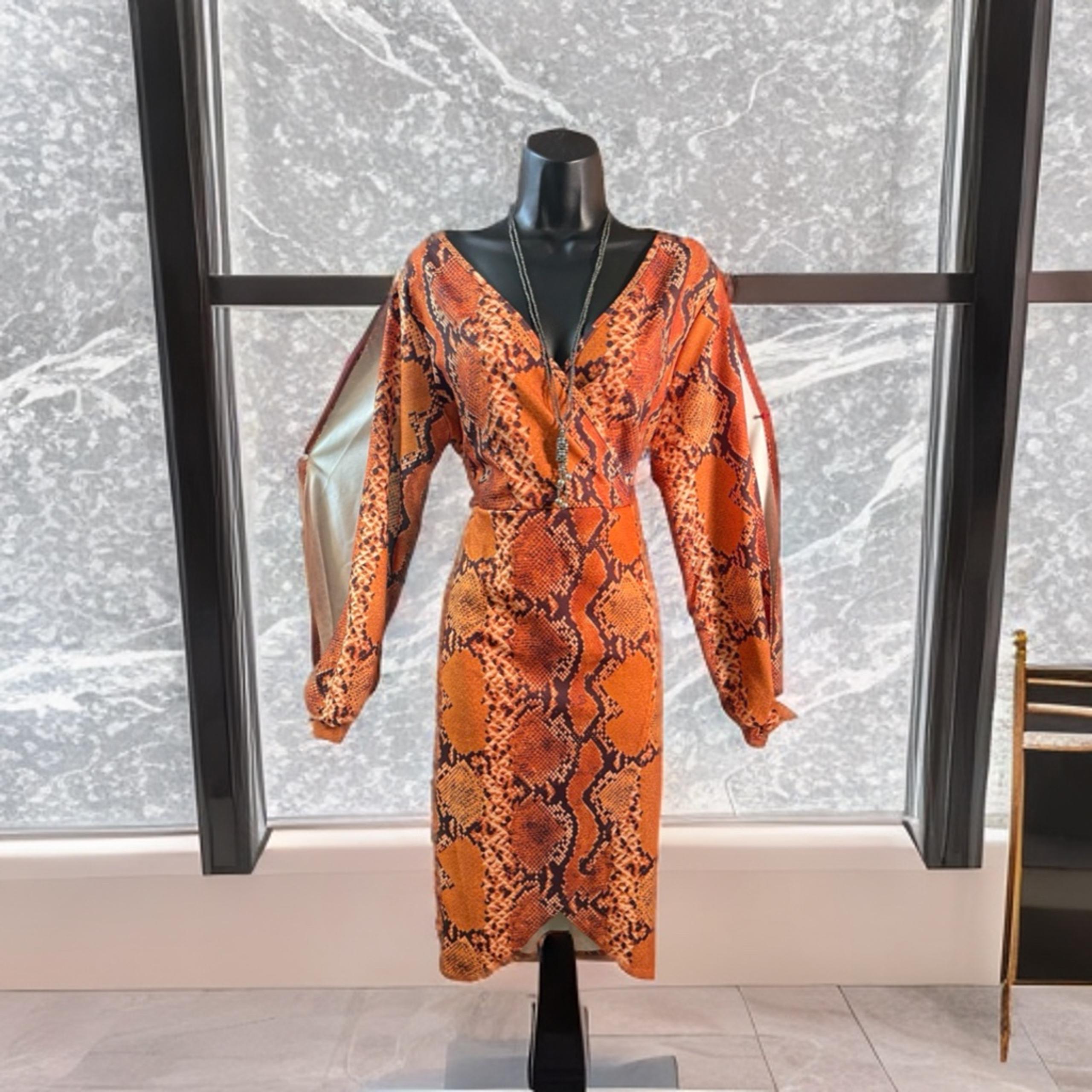 :** "Chic Alert! NWT Orange Snakeskin Boohoo Wrap Dress - Size 16