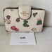 Coach Medium Corner Zip Wallet in Spaced Floral Field Chalk/ Multi CA737 EUC