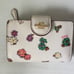 Coach Medium Corner Zip Wallet in Spaced Floral Field Chalk/ Multi CA737 EUC