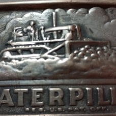 Vintage 1970's caterpillar brass belt buckle