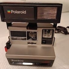 Vintage Polaroid Sun600 Camera with bag and film