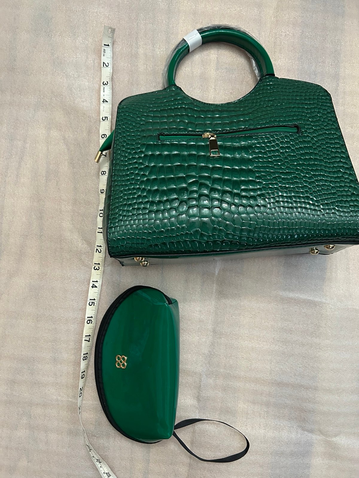Green handbag with matching color pouch