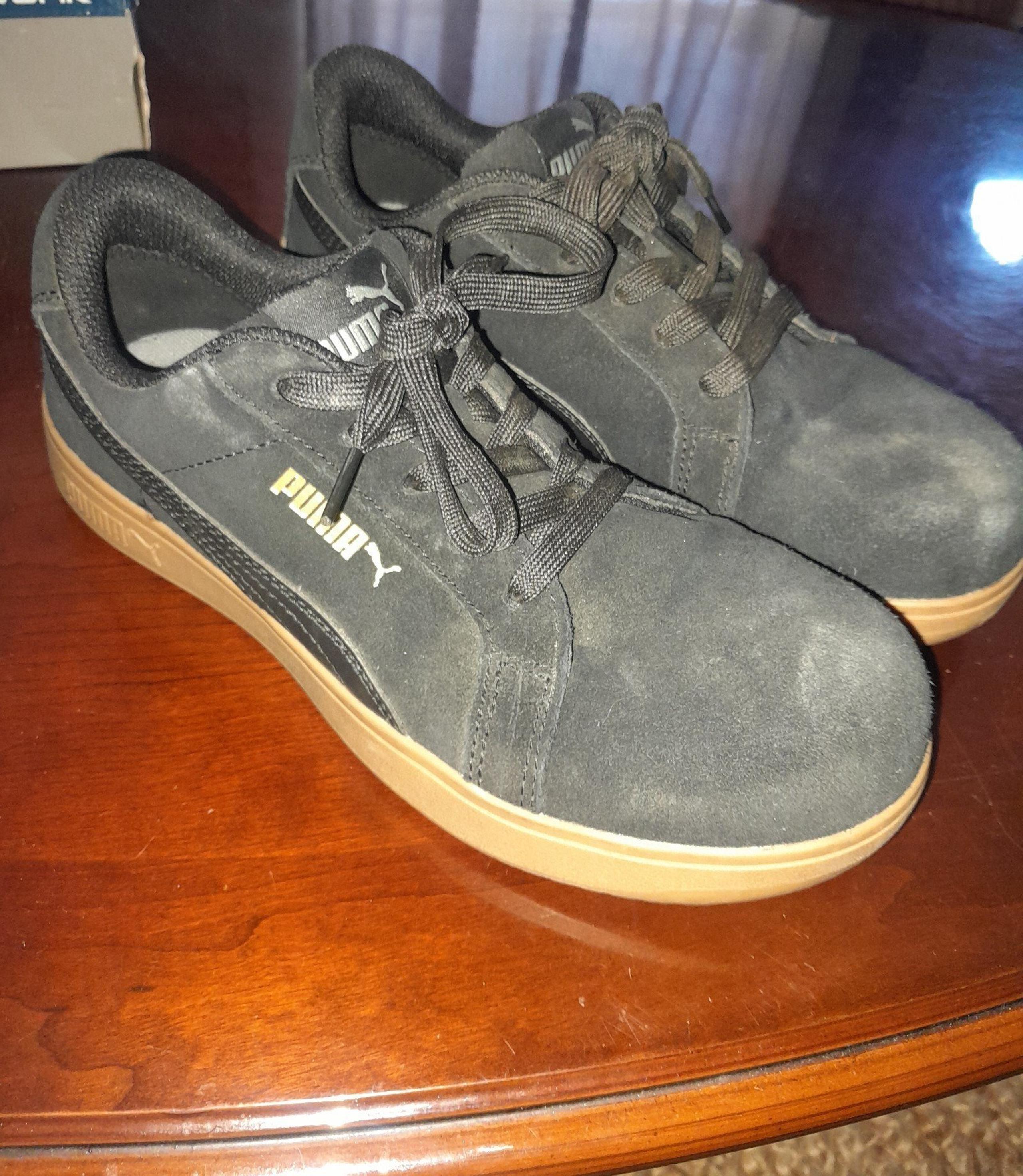 Womens black and gold Pumas