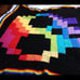 Granny Square rainbow pixel skull blanket