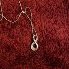Silver infinity necklace.