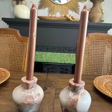 Two vase style candle holders with grapefruit leaves