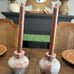 Two vase style candle holders with grapefruit leaves