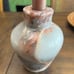 Two vase style candle holders with grapefruit leaves