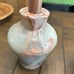 Two vase style candle holders with grapefruit leaves