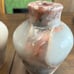 Two vase style candle holders with grapefruit leaves
