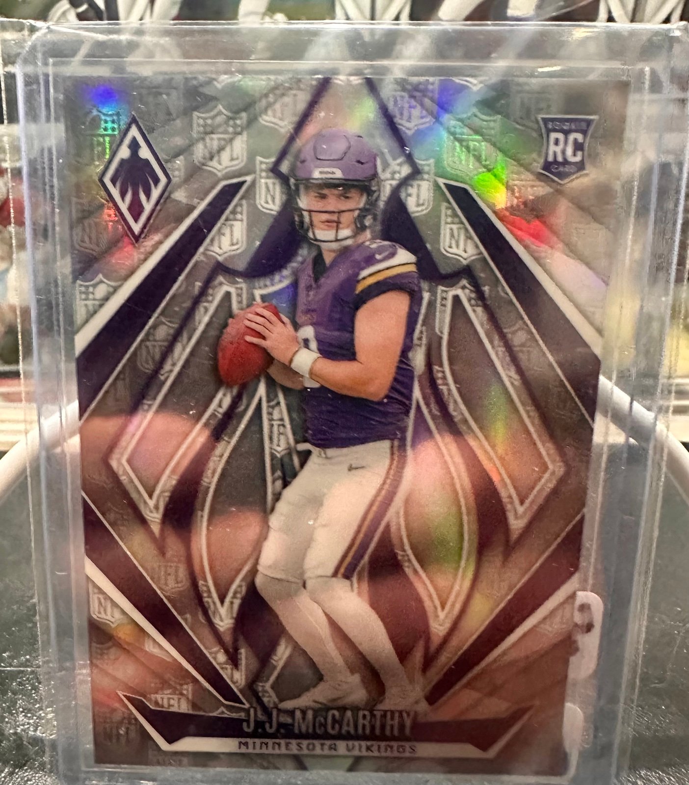 2024 Panini Phoenix JJ McCarthy NFL Shield Insert Rookie Refractor. /150