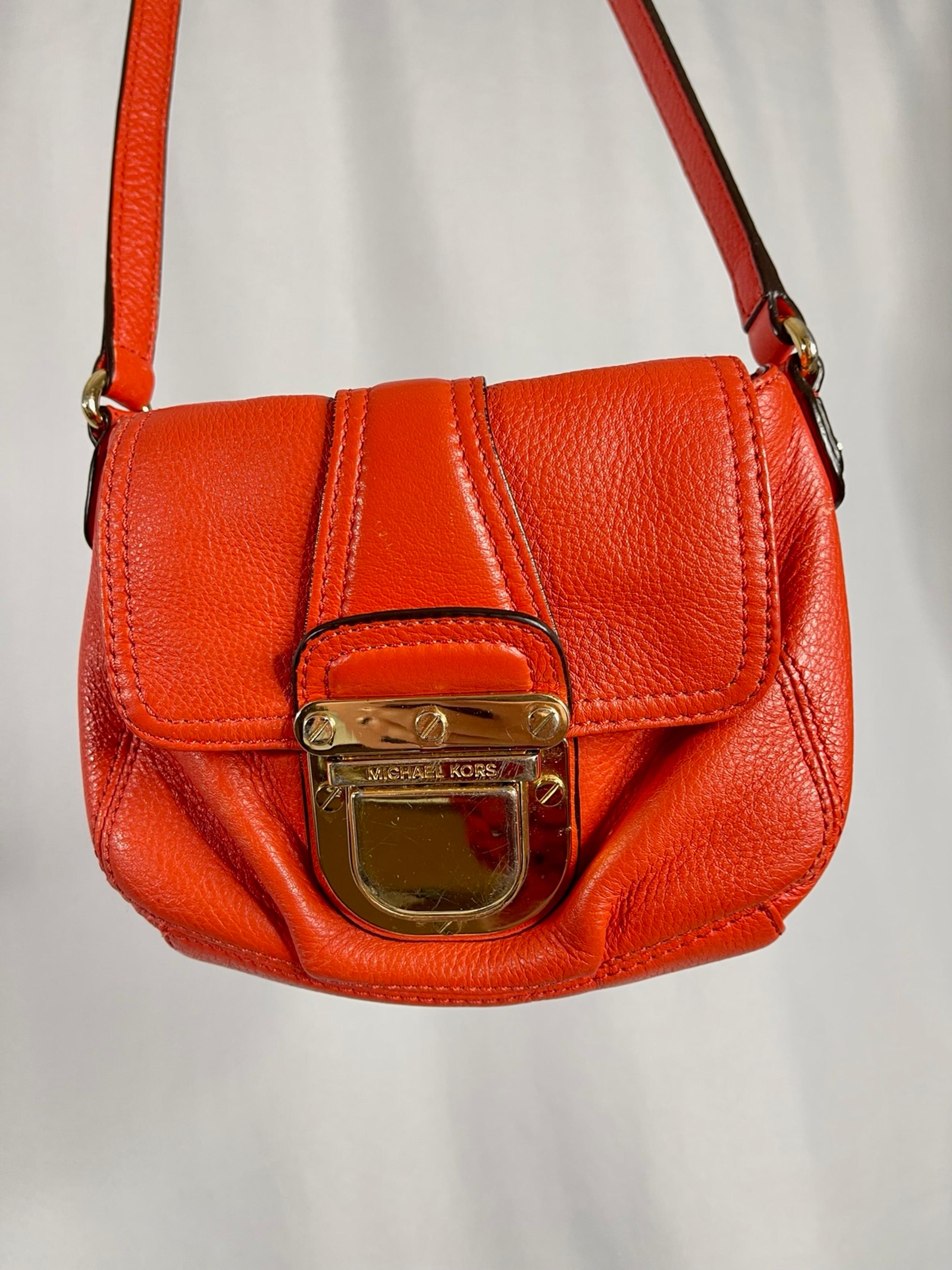 Michael Kors | small red-orange pebbled leather 'Charlton' gold buckle crossbody
