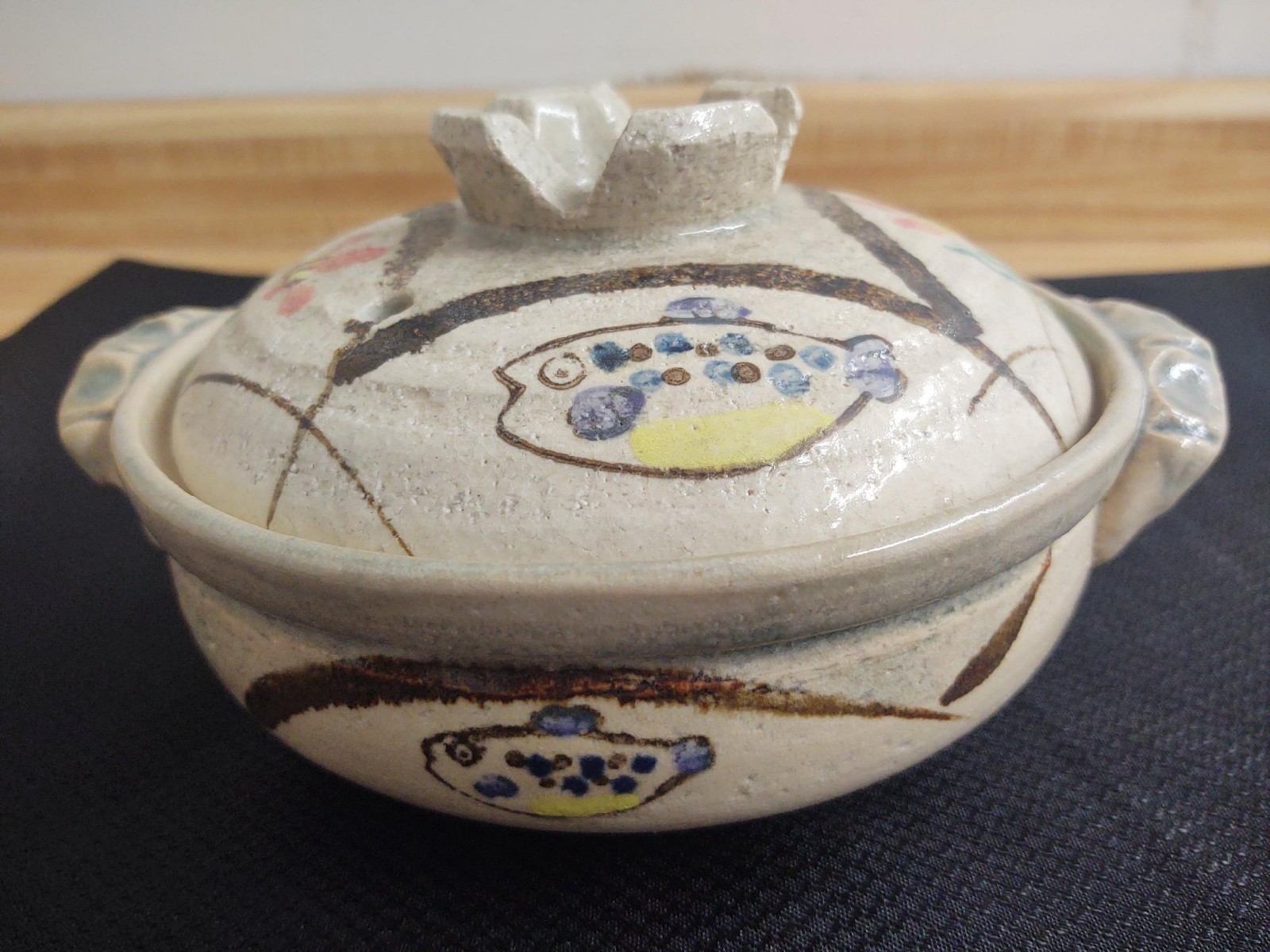 MCM casserole pot; pottery with fish and floral graphics.