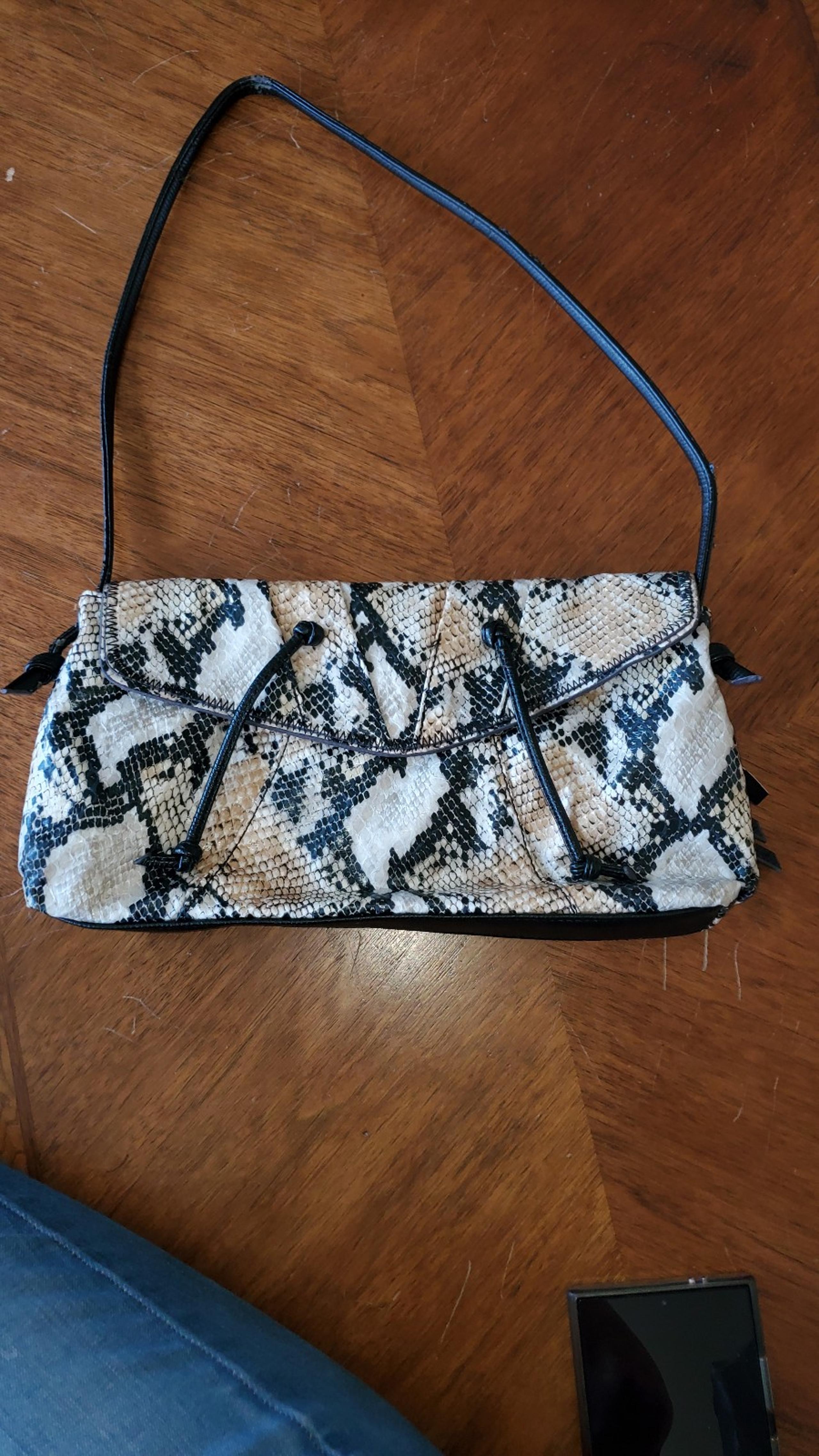 Vintage Falchi snakeskin clutch style shoulder strap handbag. Flap closure.