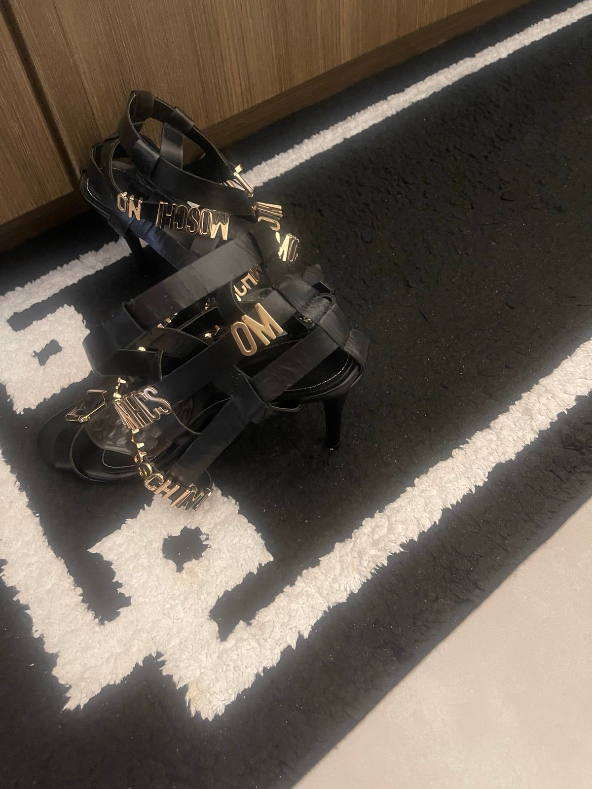 Very cute black and gold sandals with M-O-S-C-H-I-N-O gold lettering