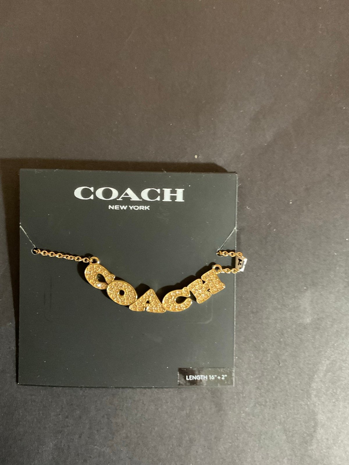 Coach gold neck necklace