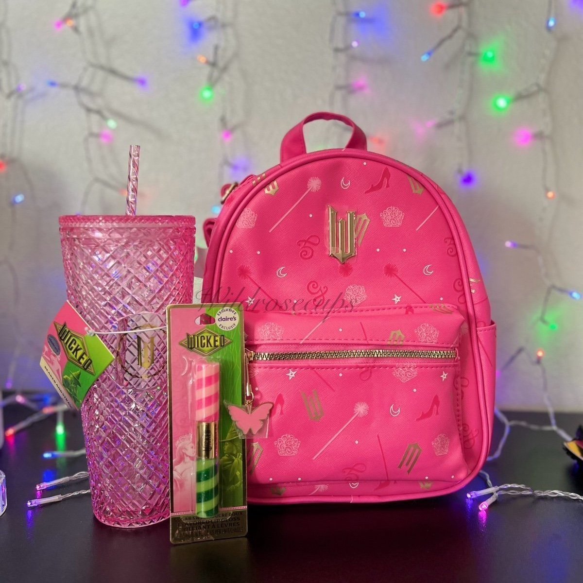 Claires x wicked Glinda Backpack, Glinda pink Tumbler, & Elphaba Glinda lipgloss