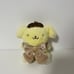 Sanrio Pompompurin mascot with ribbon