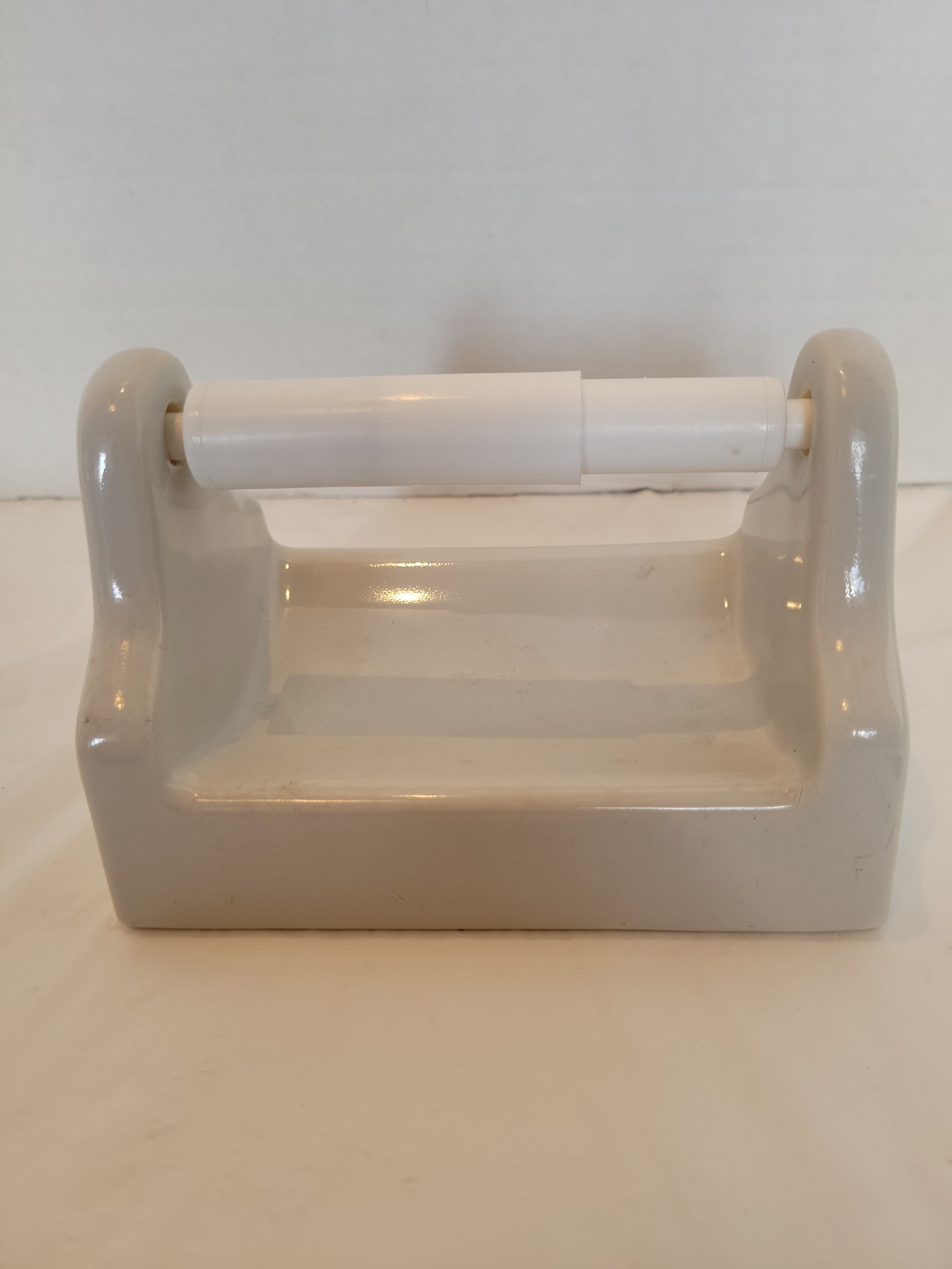 White porcelain ceramic glossy toilet paper holder. SHLF GG