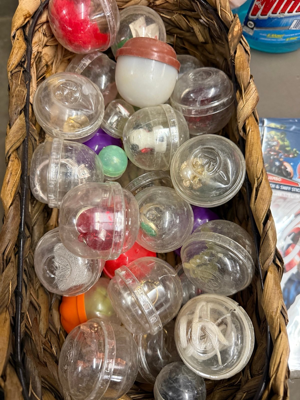 Basket full of old vending machine toys
