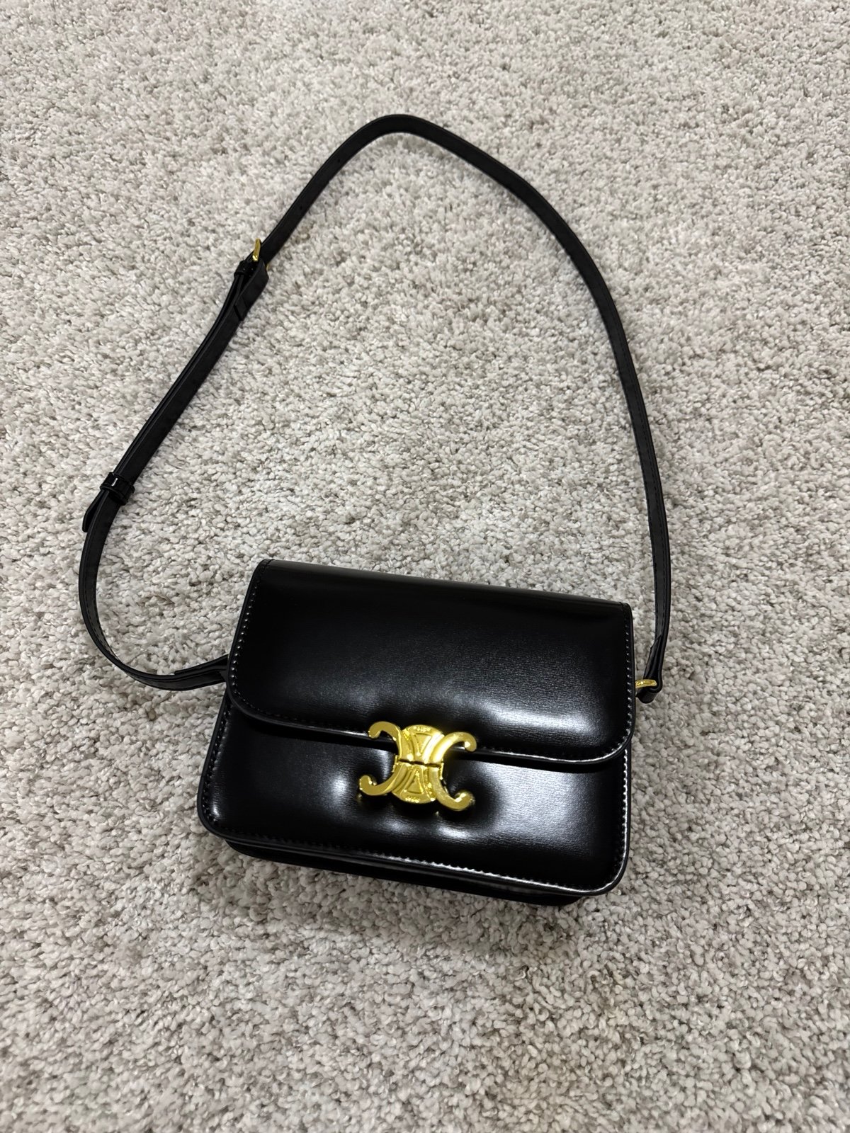 Black trendy bag with gold hardware
