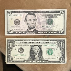 Pair of triple 7s one 5 dollar bill one 1 dollar bill
