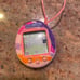 Tamagotchi Connection pastel pink with purple