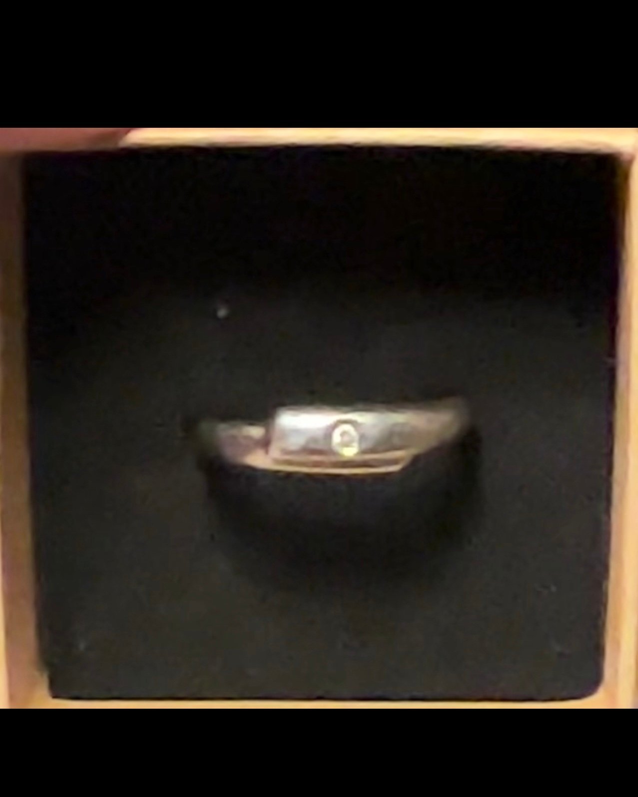 Vintage platinum 950 milor band with small round center diamond