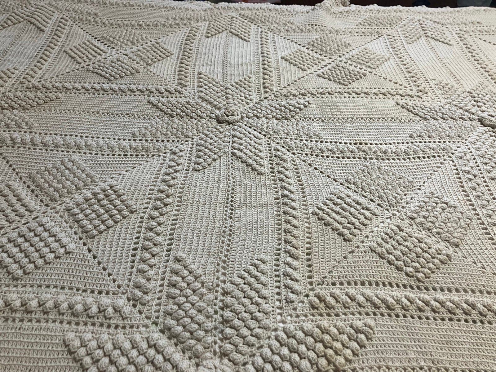 Vintage full size, heavy crocheted bedspread.Pictured on a queen sized bed.