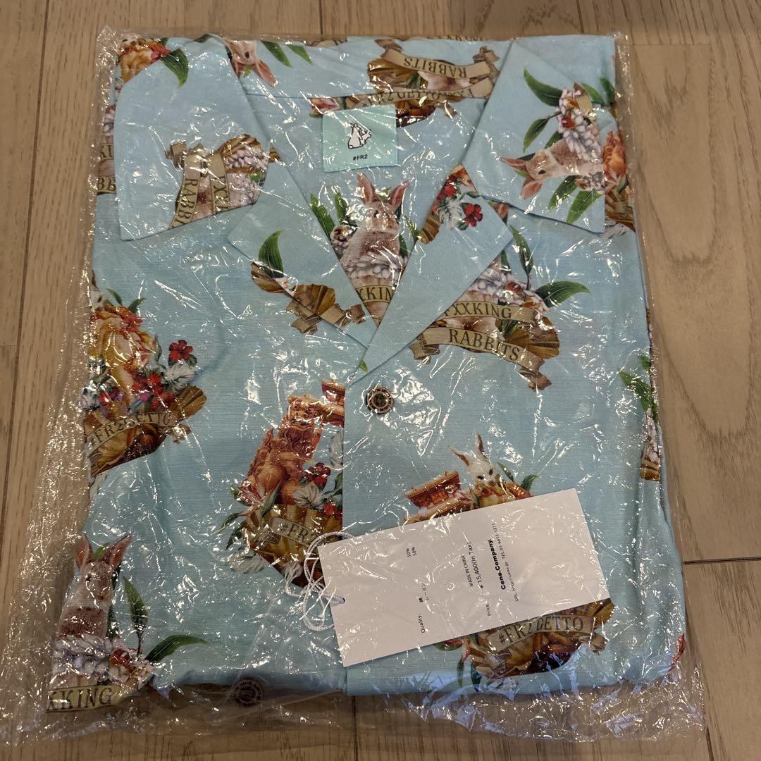 Aloha shirt with animal and floral print.