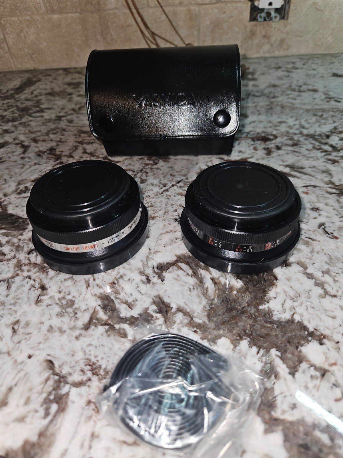 2 Yashica lens & case