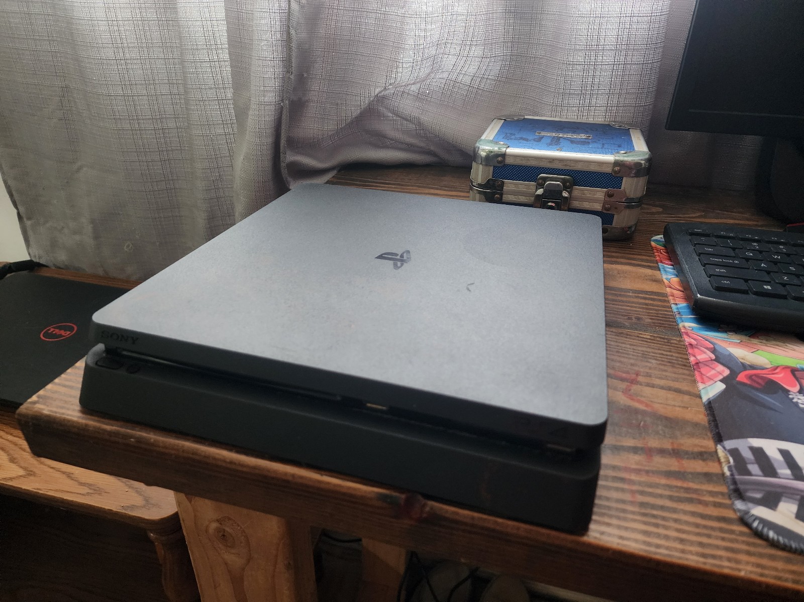 Playstation 4 with two dualshock controllers and wires