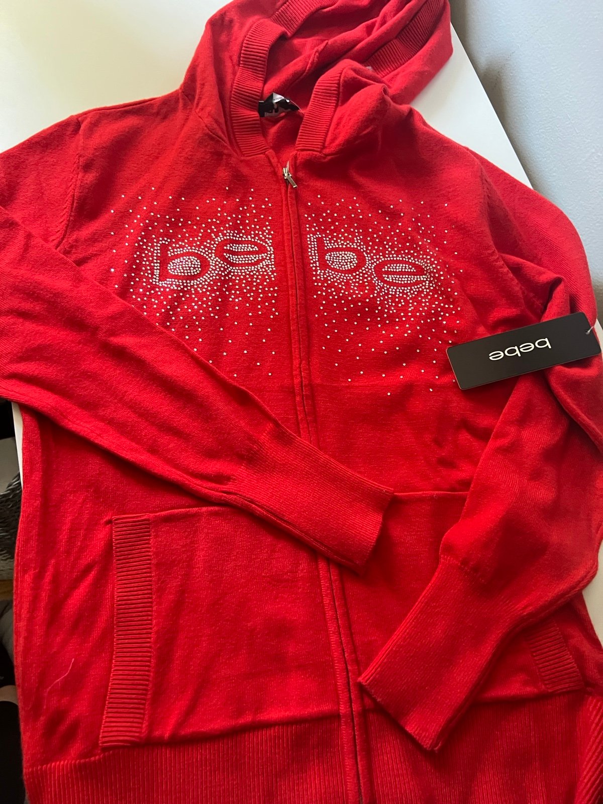 Red Bebe rhinestone zip up sweater