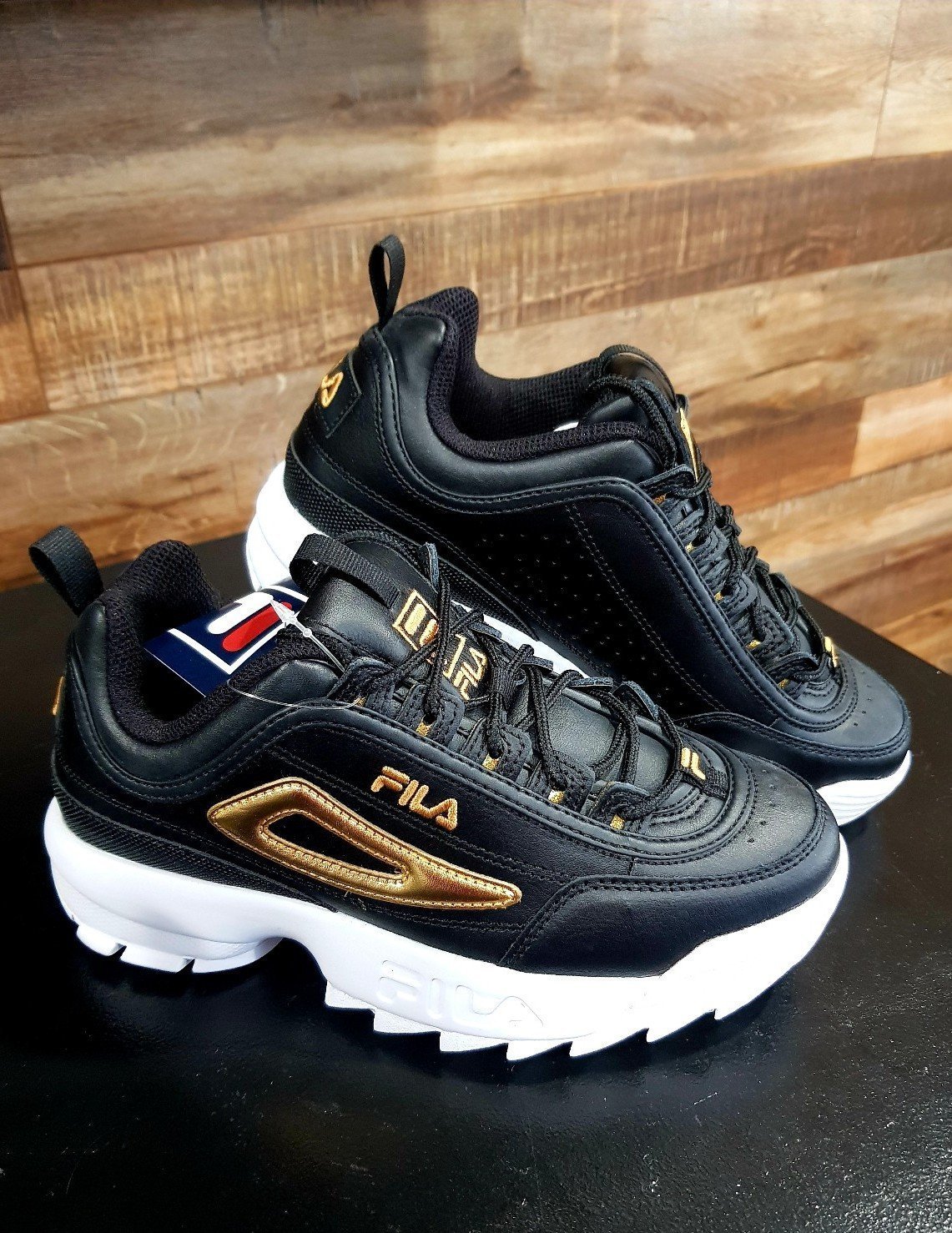Fila disruptor black and gold online