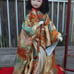 Japanese porcelain doll in glass wooden display vintage