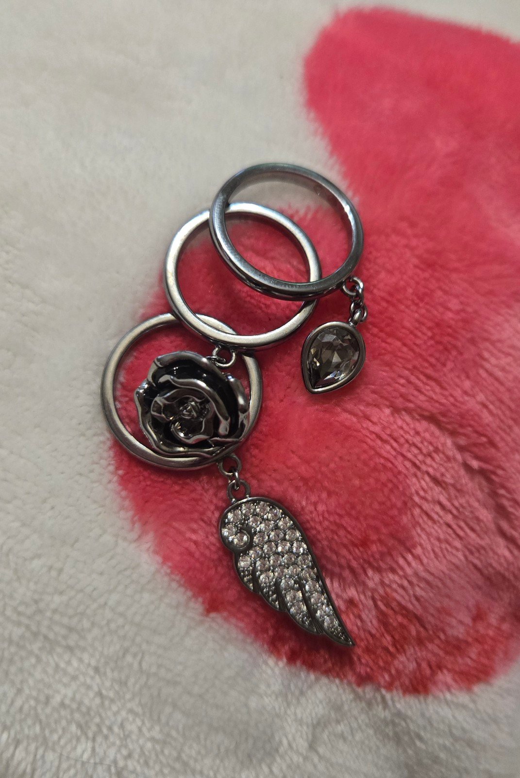 SWAROVSKI Wing, rose, and crystal charm ring trio